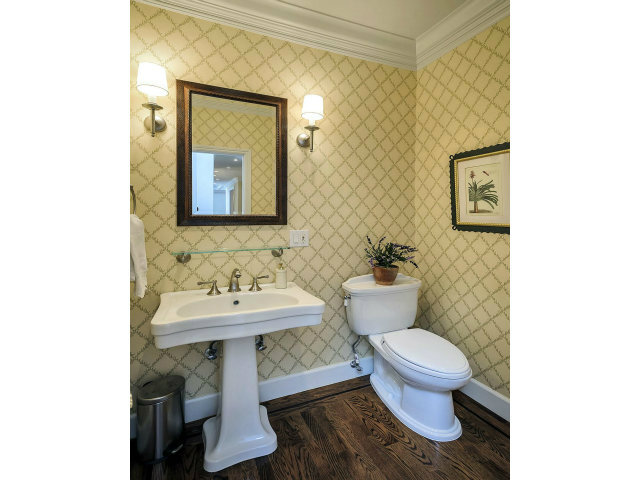 500 Pullman Road Hillsborough, CA 94010 - Photo 16 of 20 a bathroom with a toilet sink and mirror