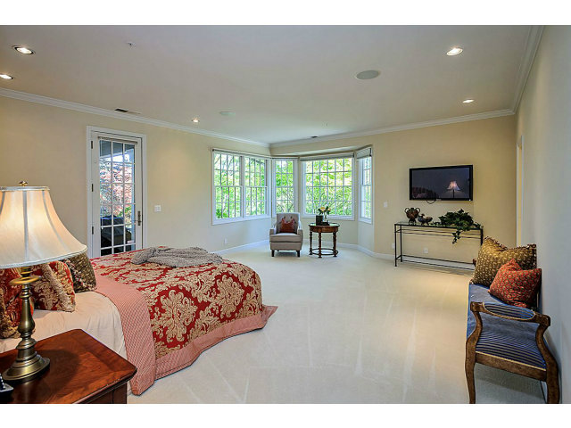 500 Pullman Road Hillsborough, CA 94010 - Photo 9 of 20 a bedroom with furniture and a flat screen tv