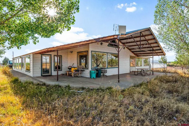 a view of a backyard of a house