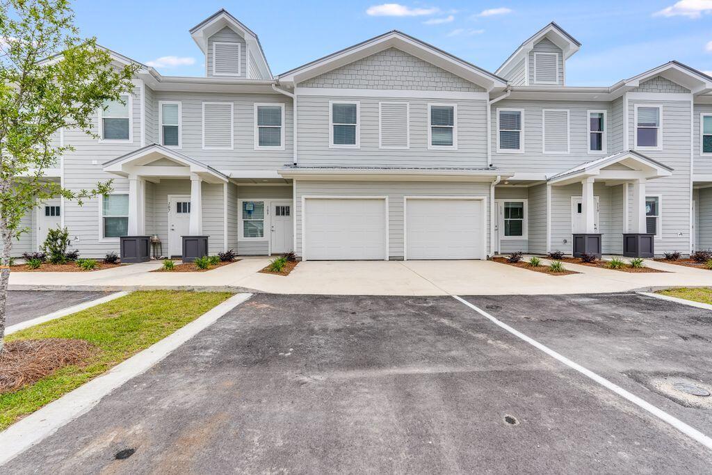 91 Date Palm Lane Freeport, FL 32439 - Photo 14 of 17 a front view of a house with a yard