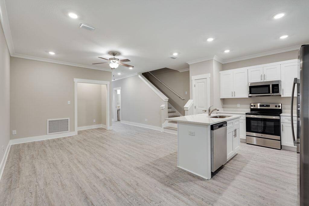 91 Date Palm Lane Freeport, FL 32439 - Photo 2 of 17 a kitchen with a stove and a sink