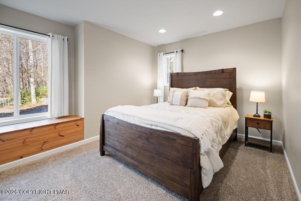 366 Appleseed Road Pocono Pines, PA 18350 - Photo 20 of 32 a bedroom with a bed and a large window