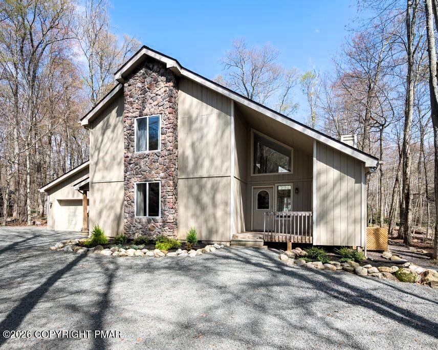 366 Appleseed Road Pocono Pines, PA 18350 - Photo 2 of 32 a front view of a house with a yard