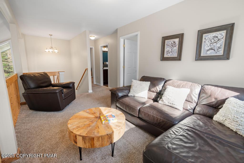 366 Appleseed Road Pocono Pines, PA 18350 - Photo 22 of 32 a living room with furniture and a couch