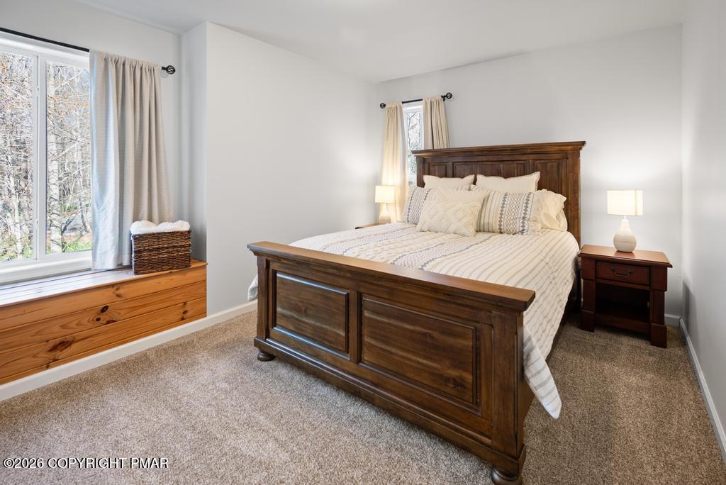 366 Appleseed Road Pocono Pines, PA 18350 - Photo 25 of 32 a bedroom with a bed and a large window