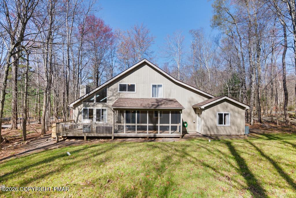 366 Appleseed Road Pocono Pines, PA 18350 - Photo 27 of 32 a view of a white house with a big yard and large trees