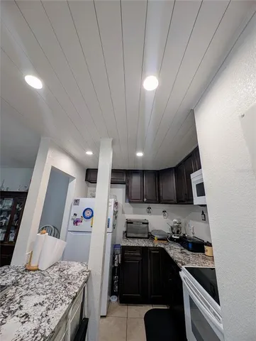 a kitchen with granite countertop lots of counter top space