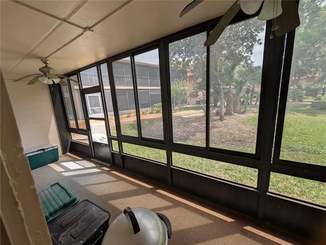 a bedroom with a bed and a balcony view
