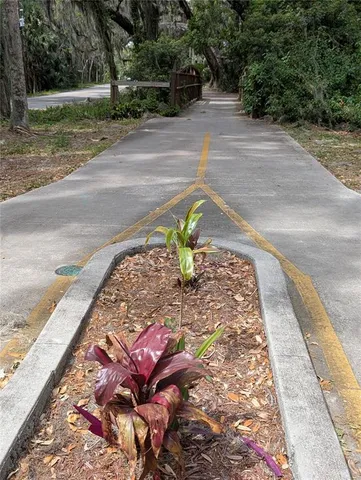 a view of a balcony with yard