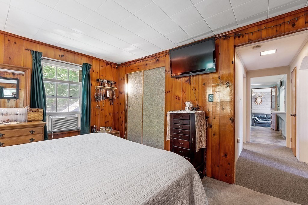 701 Silver Lake Street Athol, MA 01331 - Photo 15 of 34 a bedroom with a large bed and glass door