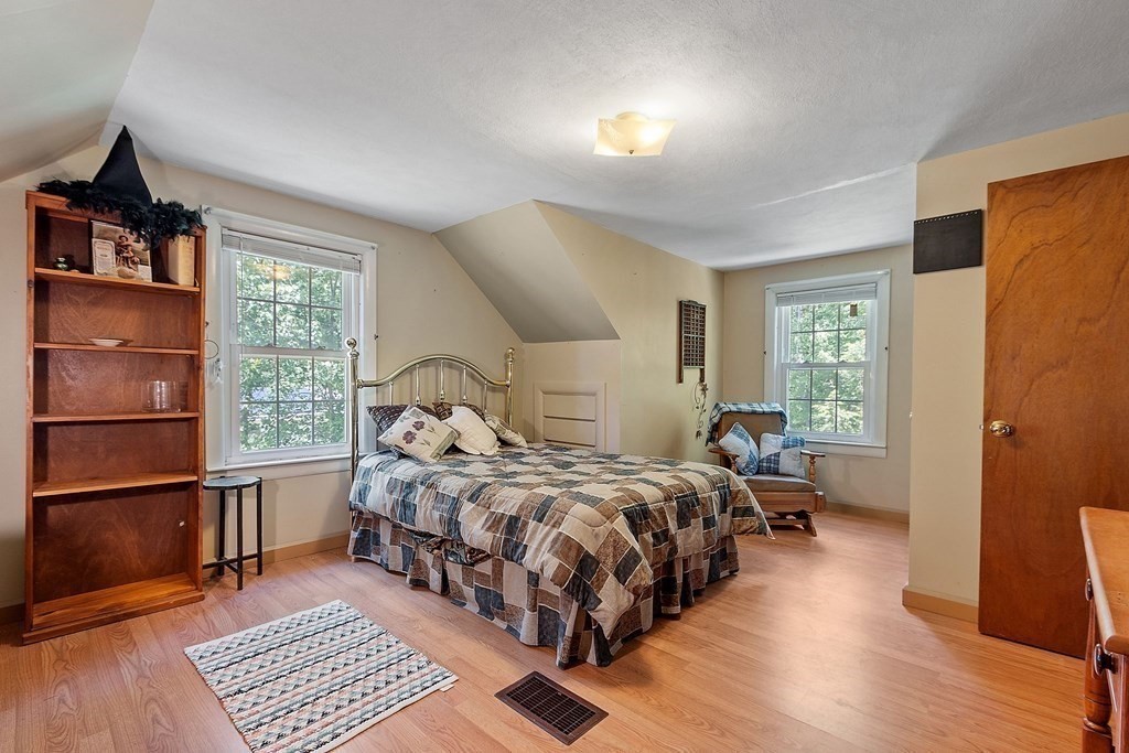 701 Silver Lake Street Athol, MA 01331 - Photo 17 of 34 a bedroom with a bed wooden floor and window