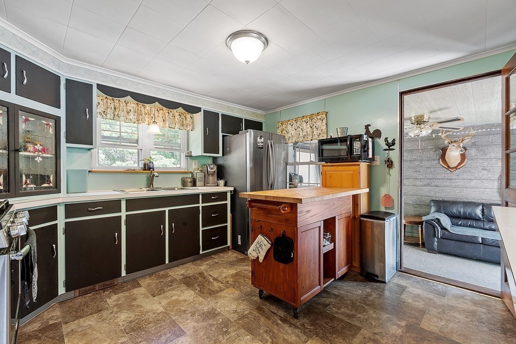 701 Silver Lake Street Athol, MA 01331 - Photo 6 of 34 a kitchen with stainless steel appliances granite countertop a stove a sink and a refrigerator