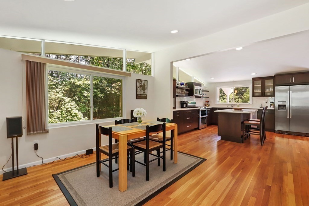 430 Heald Road Carlisle, MA 01741 - Photo 12 of 42 a view of a dining room with furniture window and wooden floor