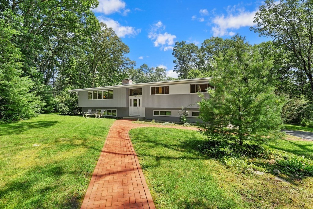 430 Heald Road Carlisle, MA 01741 - Photo 2 of 42 a front view of a house with yard