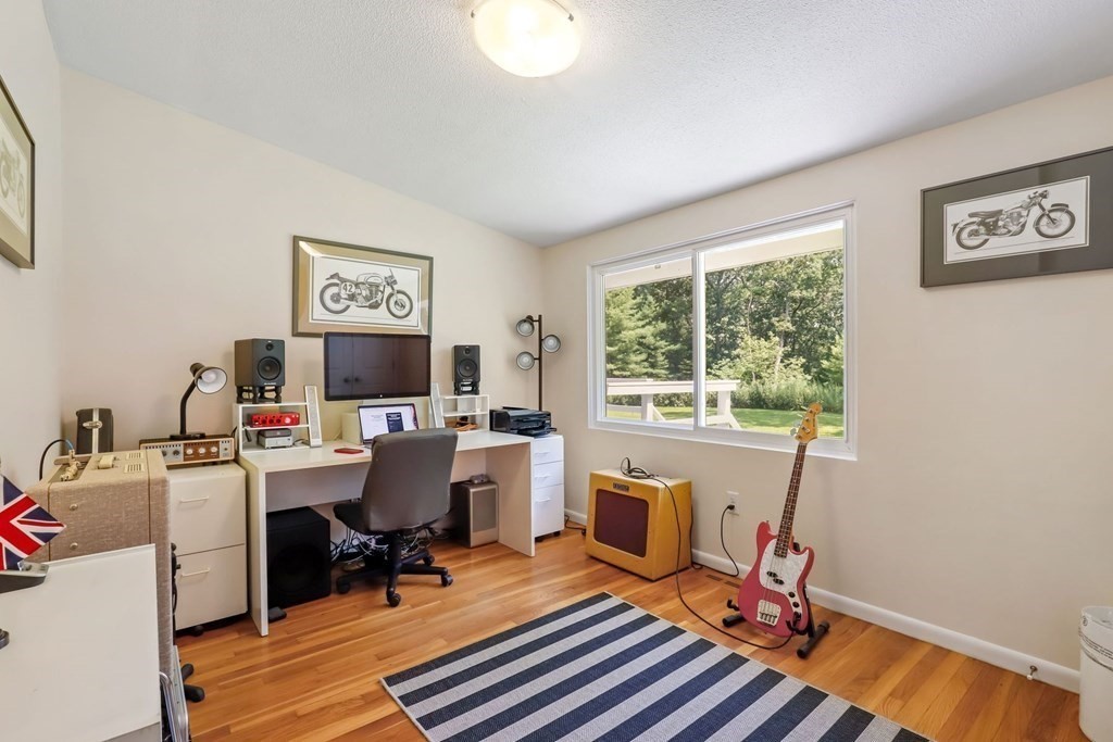 430 Heald Road Carlisle, MA 01741 - Photo 24 of 42 a view of a workspace with furniture and a window