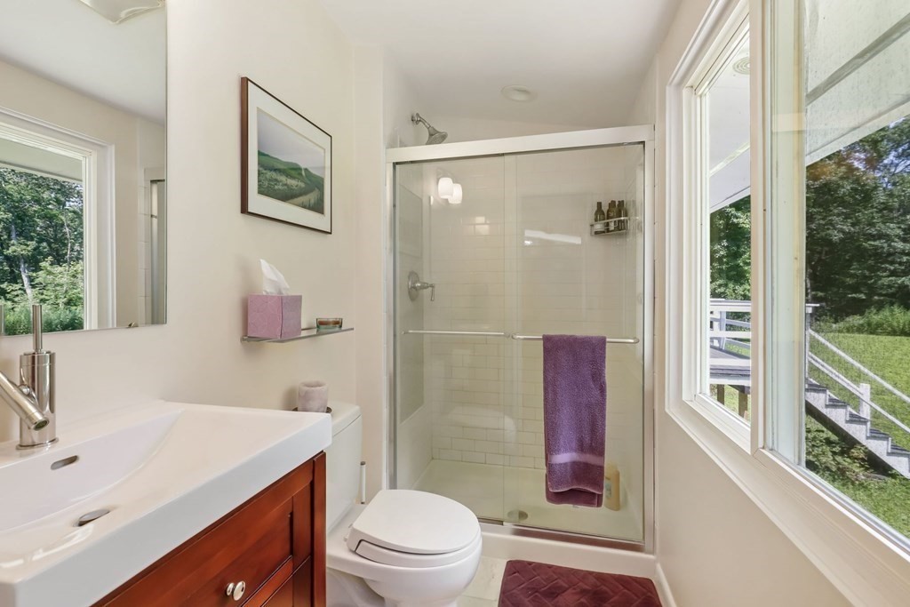 430 Heald Road Carlisle, MA 01741 - Photo 26 of 42 a bathroom with a sink a toilet and shower
