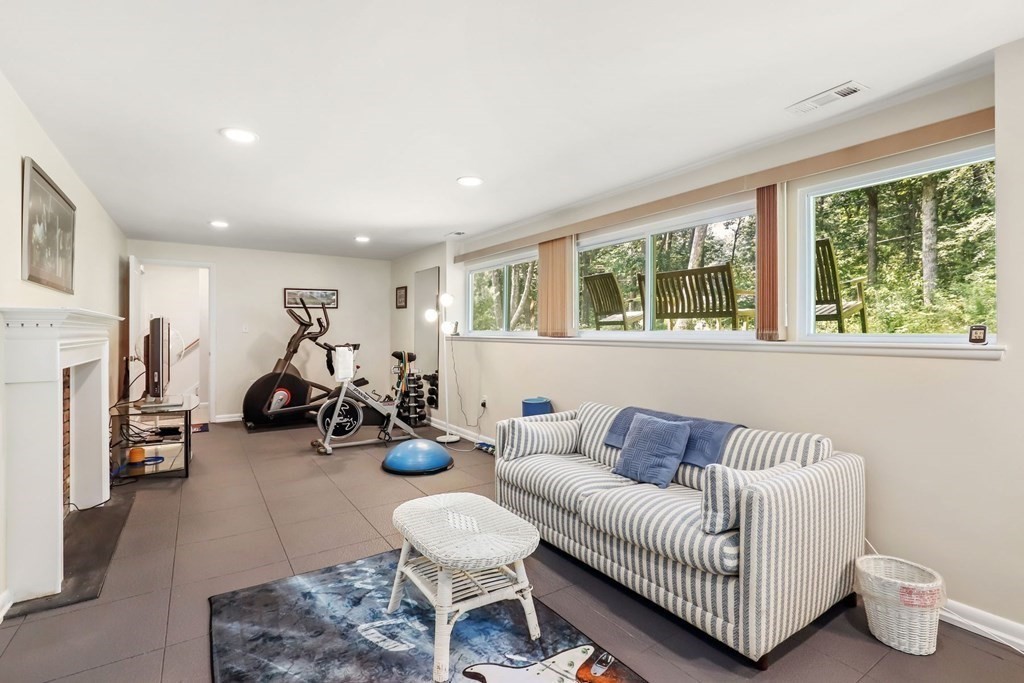 430 Heald Road Carlisle, MA 01741 - Photo 29 of 42 a living room with furniture and a flat screen tv