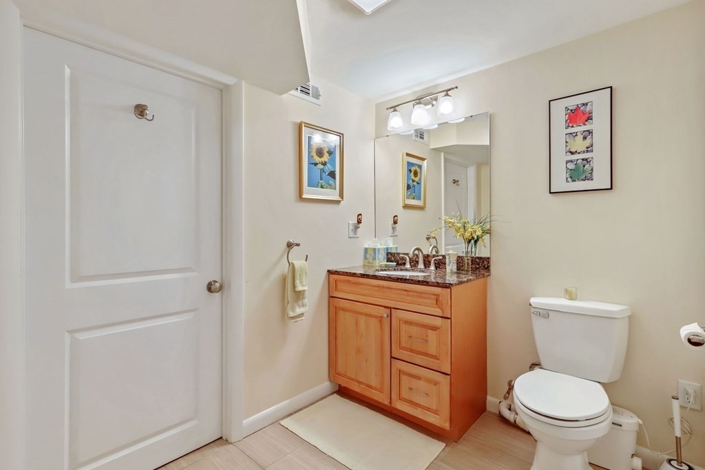 430 Heald Road Carlisle, MA 01741 - Photo 30 of 42 a bathroom with a toilet a sink and a mirror