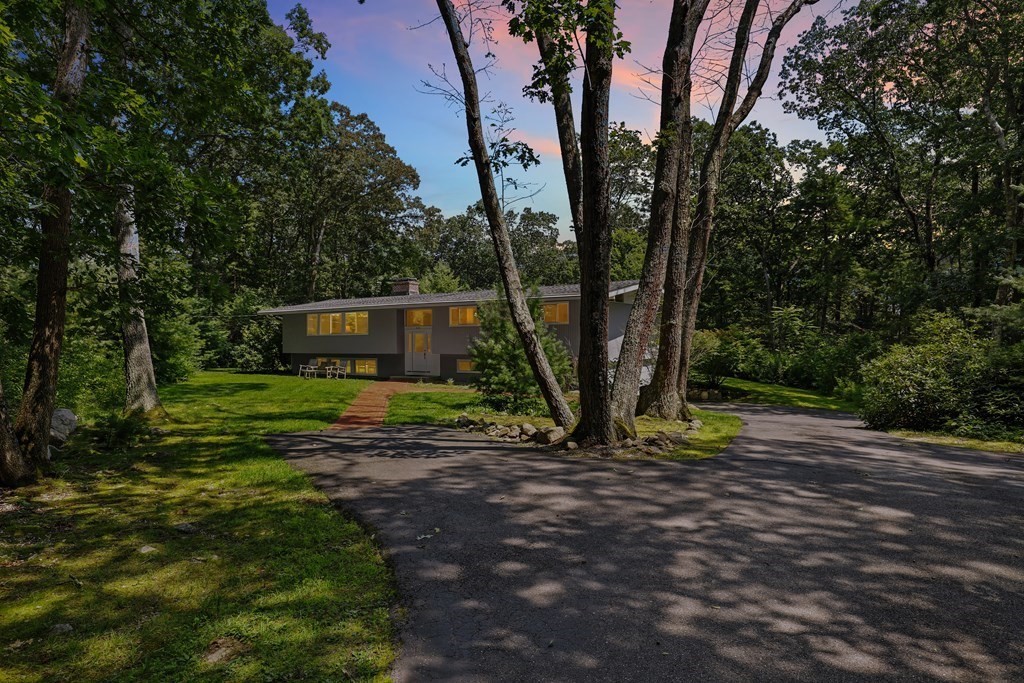 430 Heald Road Carlisle, MA 01741 - Photo 41 of 42 a view of a house with backyard and trees