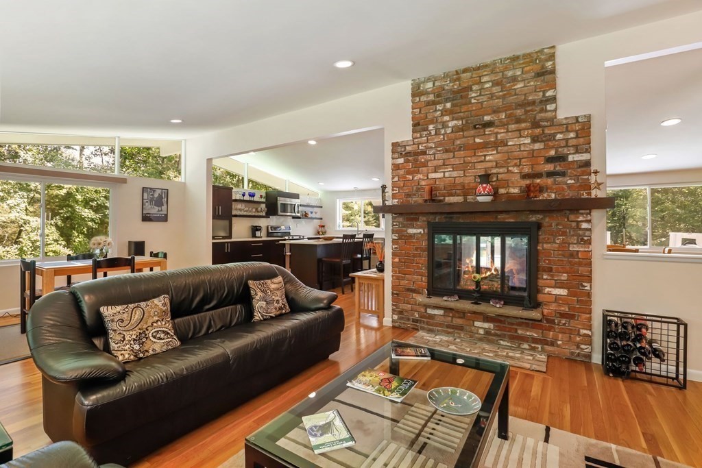430 Heald Road Carlisle, MA 01741 - Photo 10 of 42 a living room with furniture and a fireplace
