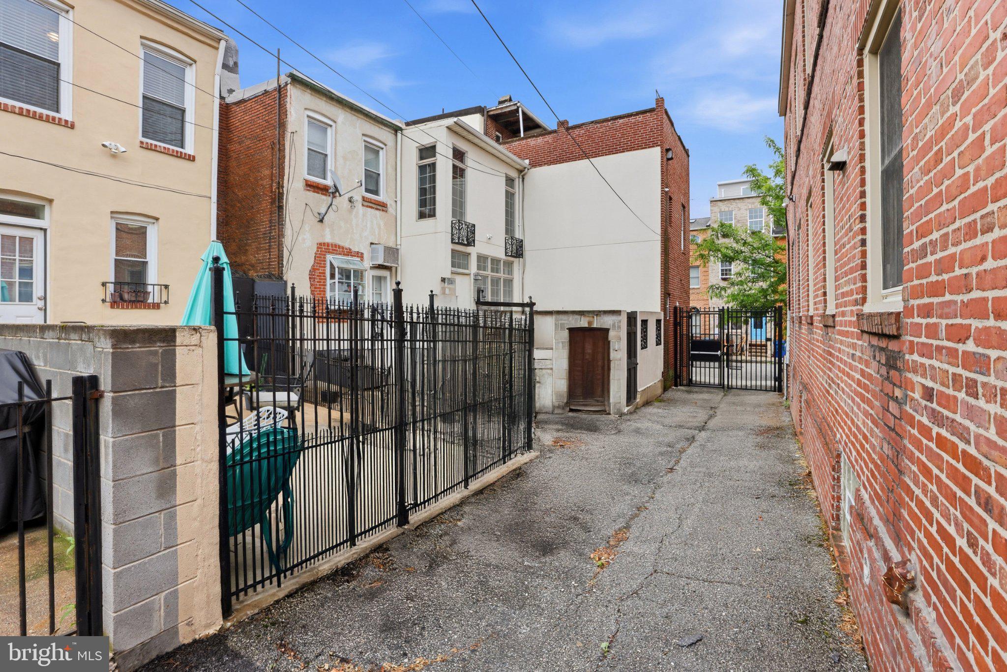 222 South Exeter Street Baltimore, MD 21202 - Photo 33 of 41 a view of a building with a door and a outdoor space
