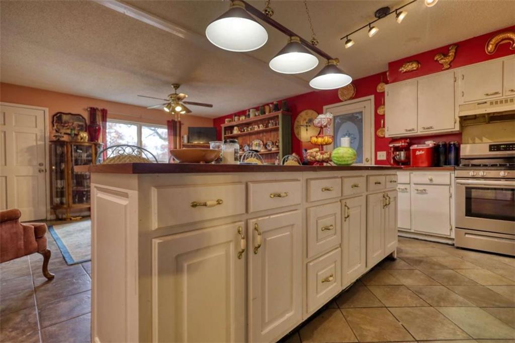 279 Spring Street Winder, GA 30680 - Photo 13 of 43 a kitchen with white cabinets and sink