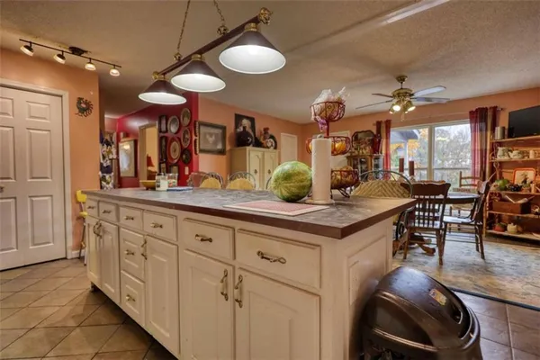 a kitchen with stainless steel appliances granite countertop a stove a sink and dishwasher cabinets