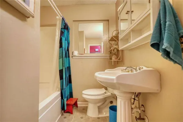 a bathroom with a sink and a toilet