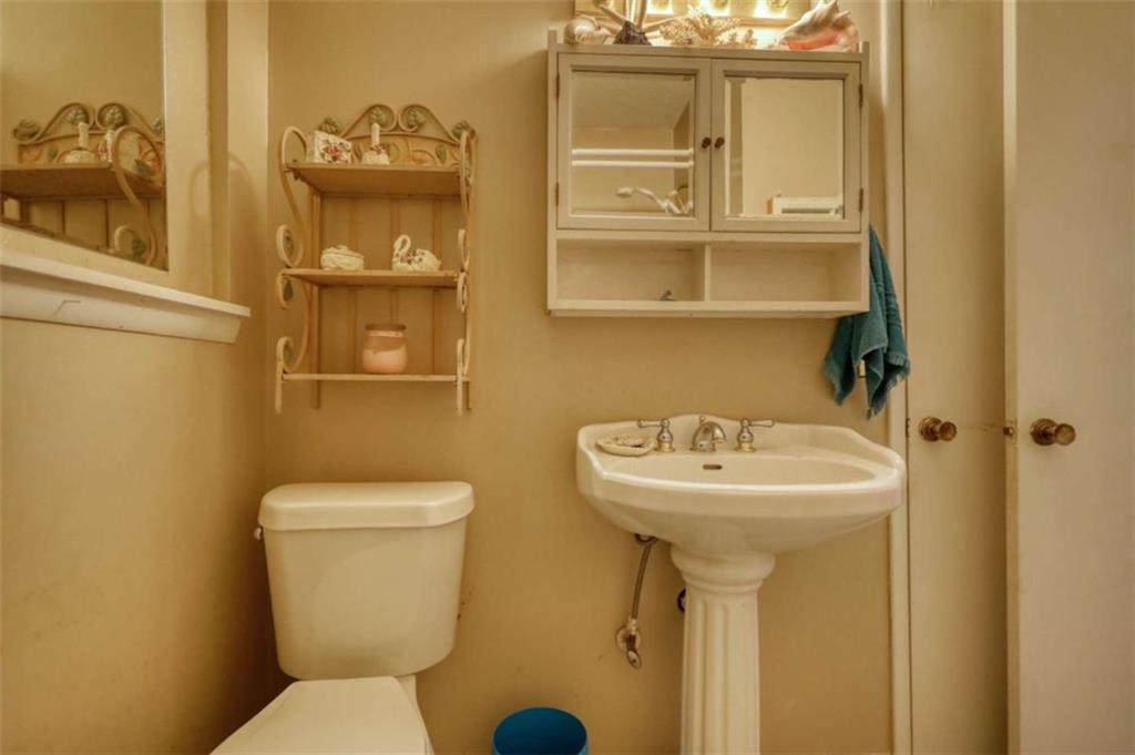 279 Spring Street Winder, GA 30680 - Photo 21 of 43 a bathroom with a sink and a toilet