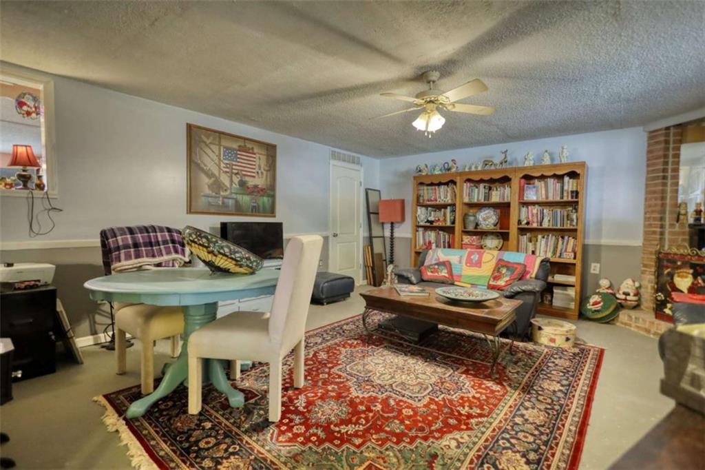 279 Spring Street Winder, GA 30680 - Photo 29 of 43 a living room with furniture and a rug