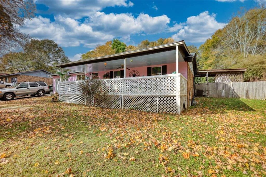 279 Spring Street Winder, GA 30680 - Photo 3 of 43 a front view of a house with a garden