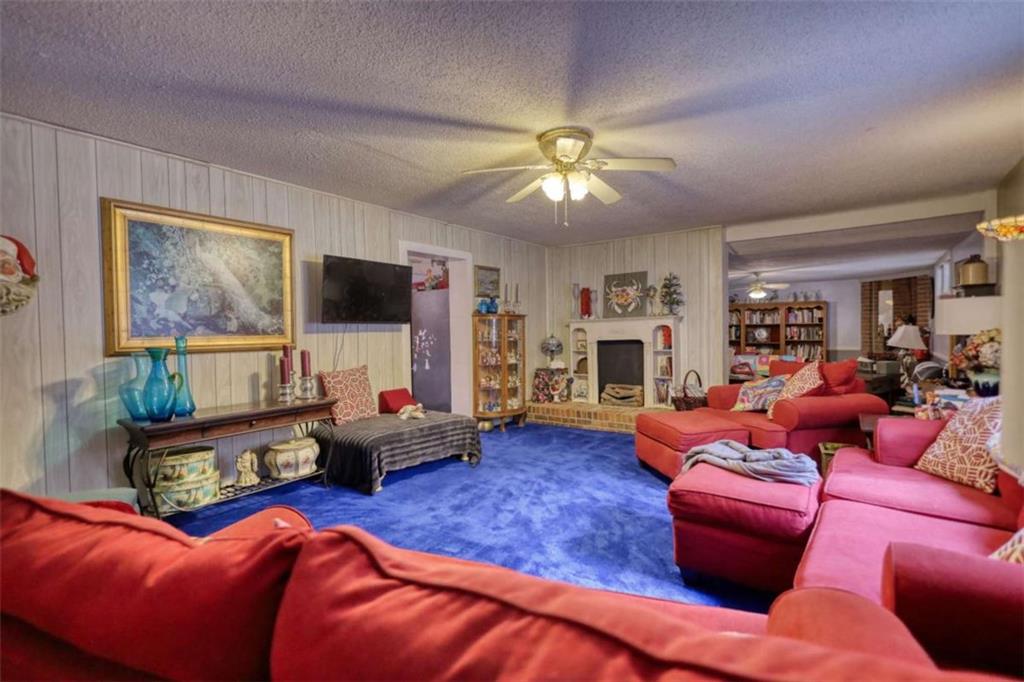 279 Spring Street Winder, GA 30680 - Photo 37 of 43 a living room with furniture kitchen view and a large window