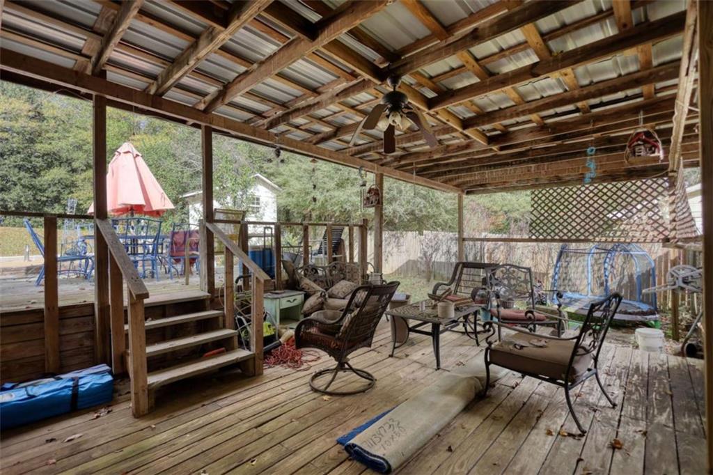 279 Spring Street Winder, GA 30680 - Photo 38 of 43 a view of a chairs and table in a patio
