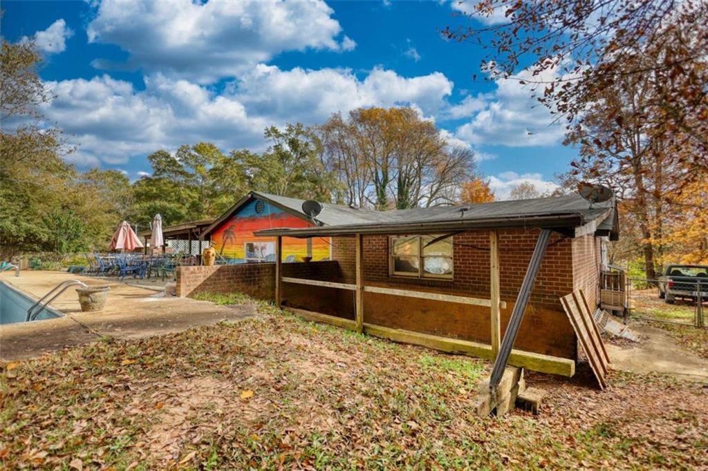 279 Spring Street Winder, GA 30680 - Photo 39 of 43 a backyard of a house with lots of green space