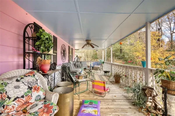 a living room filled with furniture and a chandelier
