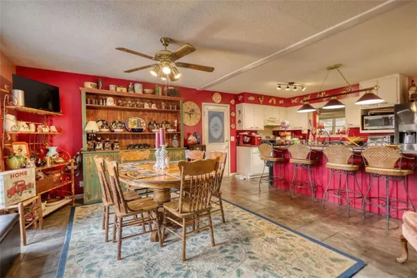 a view of a dining room with furniture window and outside view