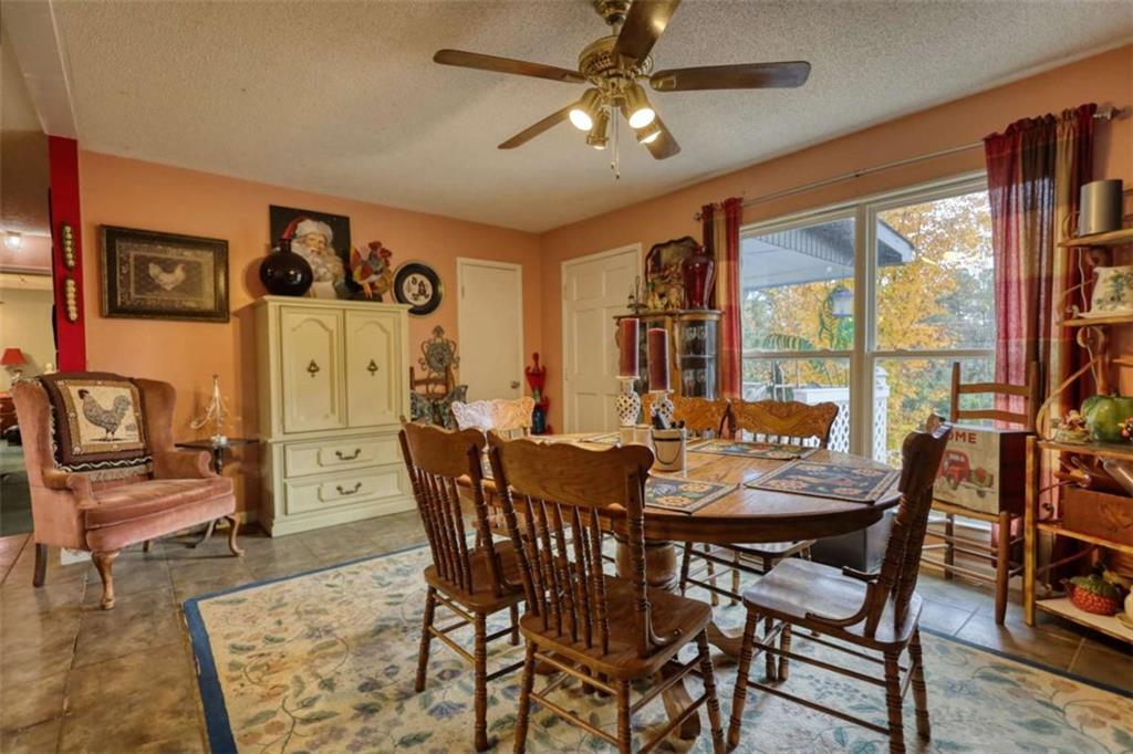 279 Spring Street Winder, GA 30680 - Photo 9 of 43 a view of a dining room with furniture window and outside view