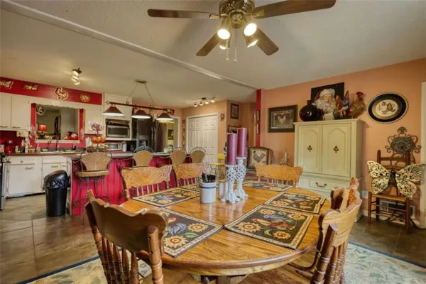a view of a kitchen area with furniture and chandelier