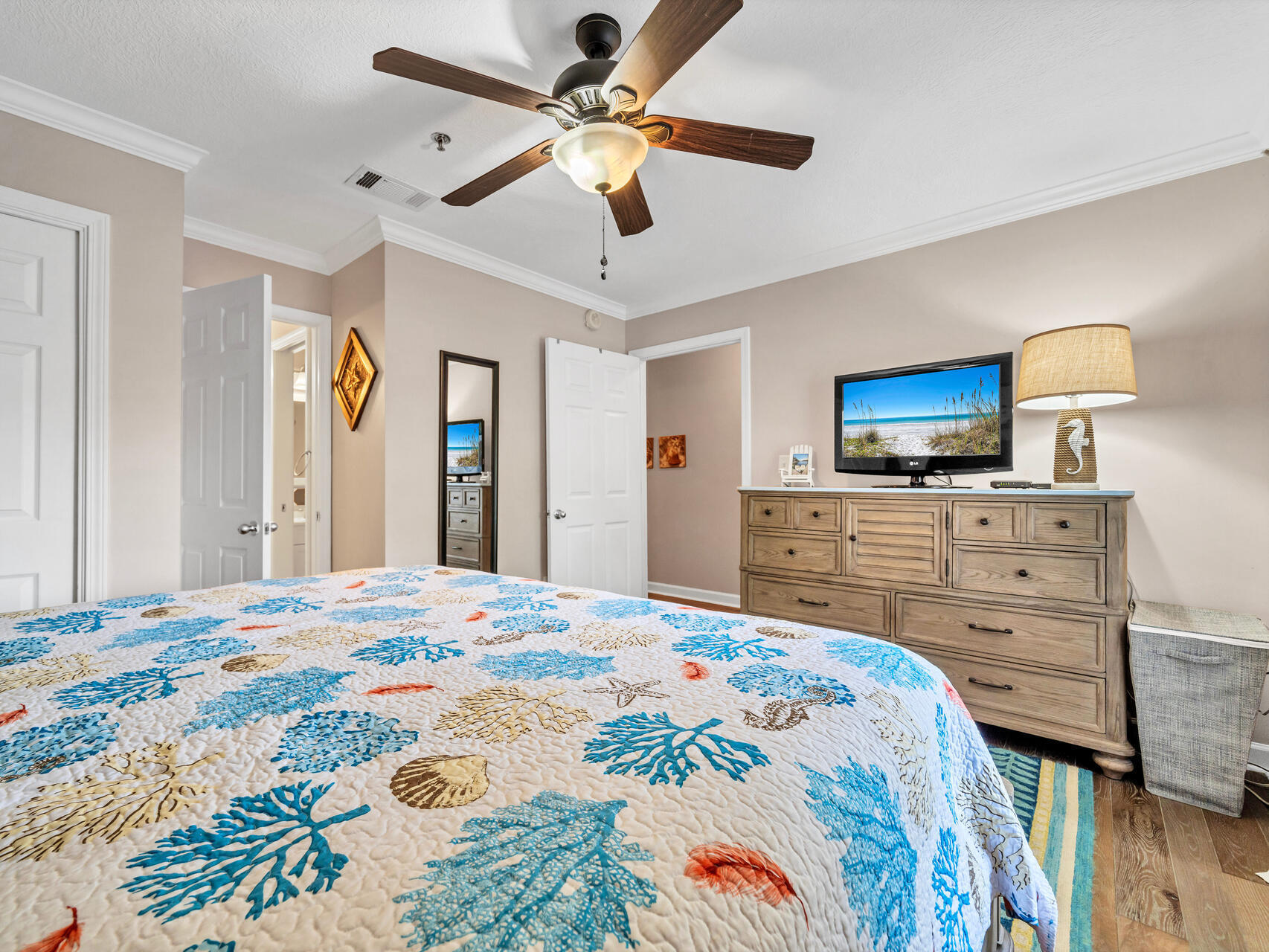 144 Spires Lane, Unit 209 Santa Rosa Beach, FL 32459 - Photo 15 of 27 a bedroom with a bed a dresser and a flat screen tv