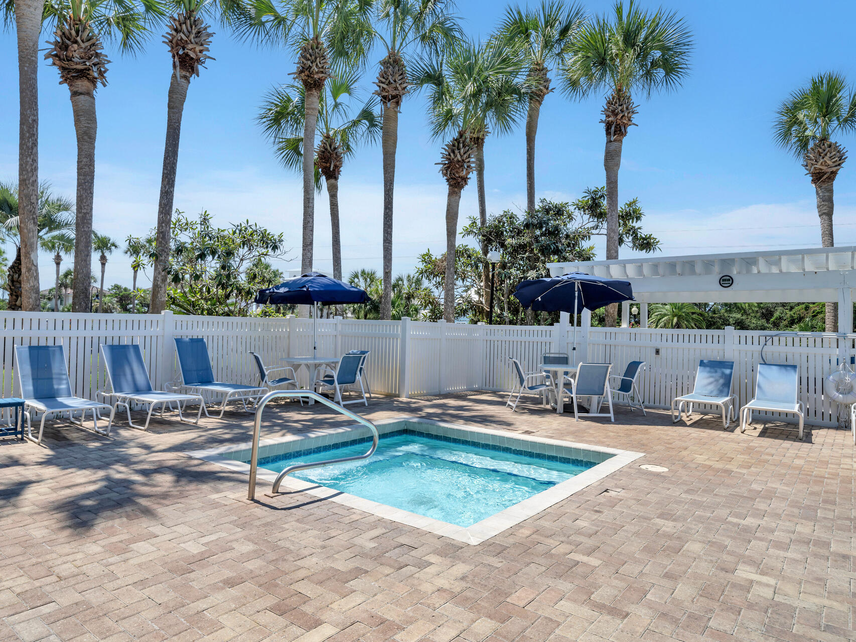 144 Spires Lane, Unit 209 Santa Rosa Beach, FL 32459 - Photo 22 of 27 a swimming pool with outdoor seating and yard