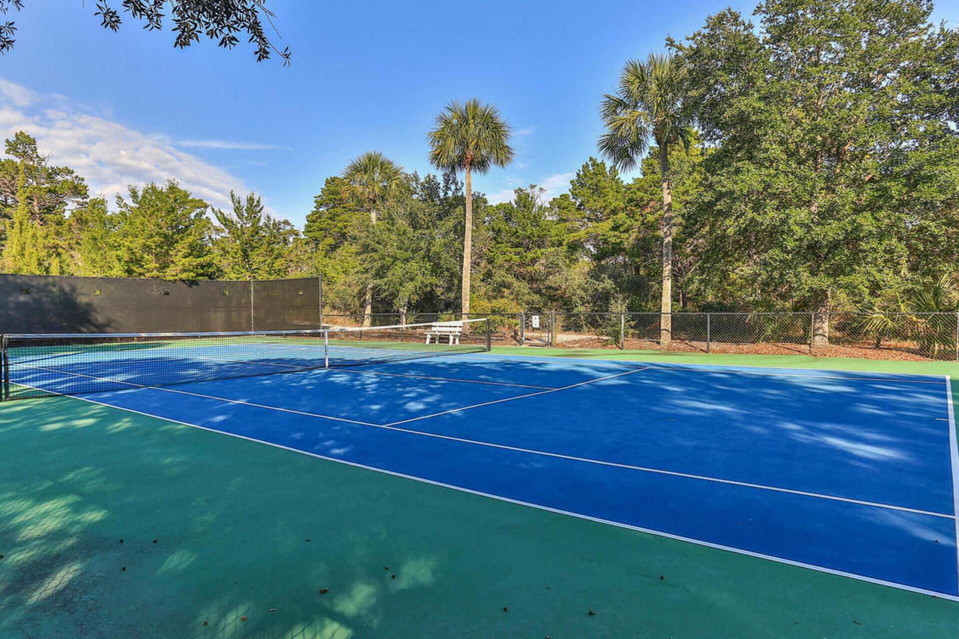 144 Spires Lane, Unit 209 Santa Rosa Beach, FL 32459 - Photo 25 of 27 a view of a tennis ground with large trees
