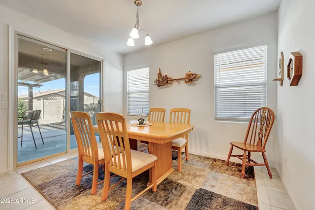a dining room with furniture and entryway