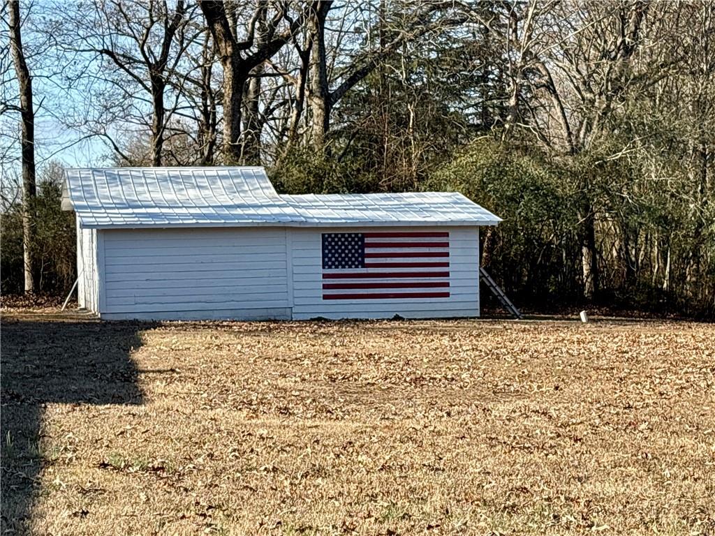 5463 Heardsville Road Cumming, GA 30028 - Photo 13 of 16 a front view of a house with a yard