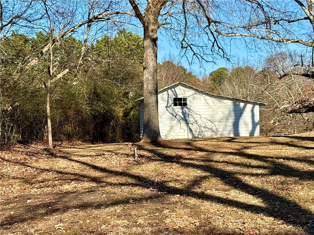 5463 Heardsville Road Cumming, GA 30028 - Photo 15 of 16 a view of a house with a snow on the road
