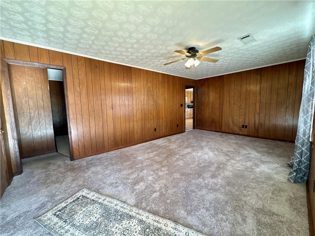 5463 Heardsville Road Cumming, GA 30028 - Photo 2 of 16 an empty room with closet and ceiling fan