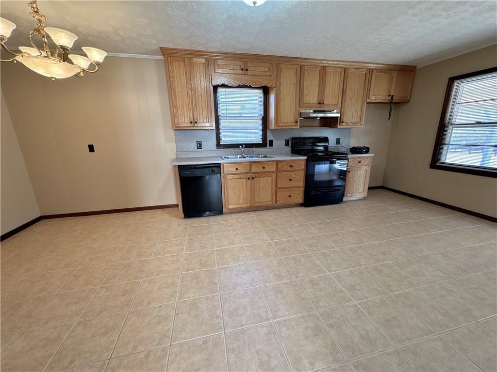5463 Heardsville Road Cumming, GA 30028 - Photo 4 of 16 a kitchen with stainless steel appliances a refrigerator a stove a sink a microwave and cabinets