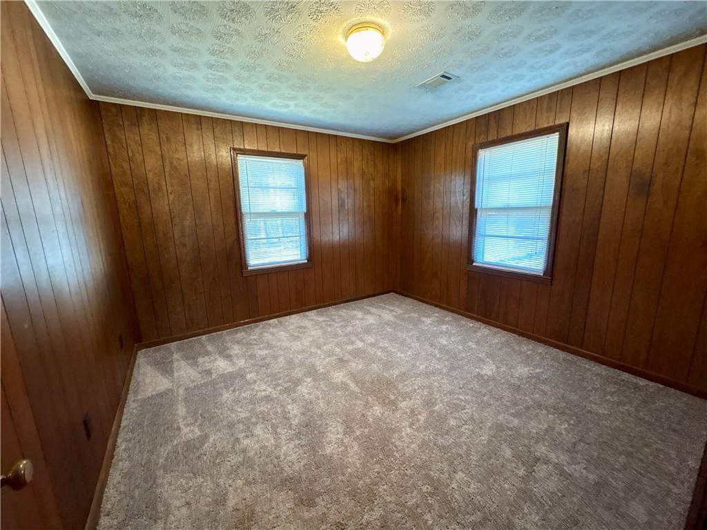 5463 Heardsville Road Cumming, GA 30028 - Photo 8 of 16 an empty room with windows