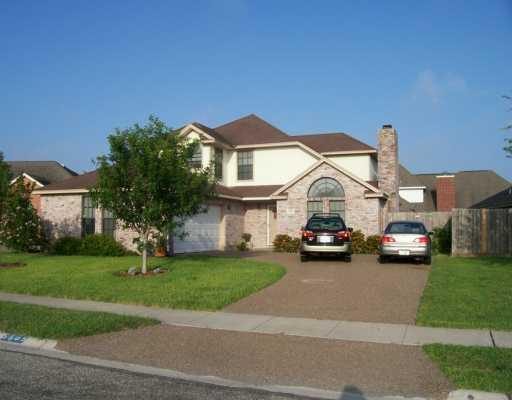 a view of multiple houses with a yard