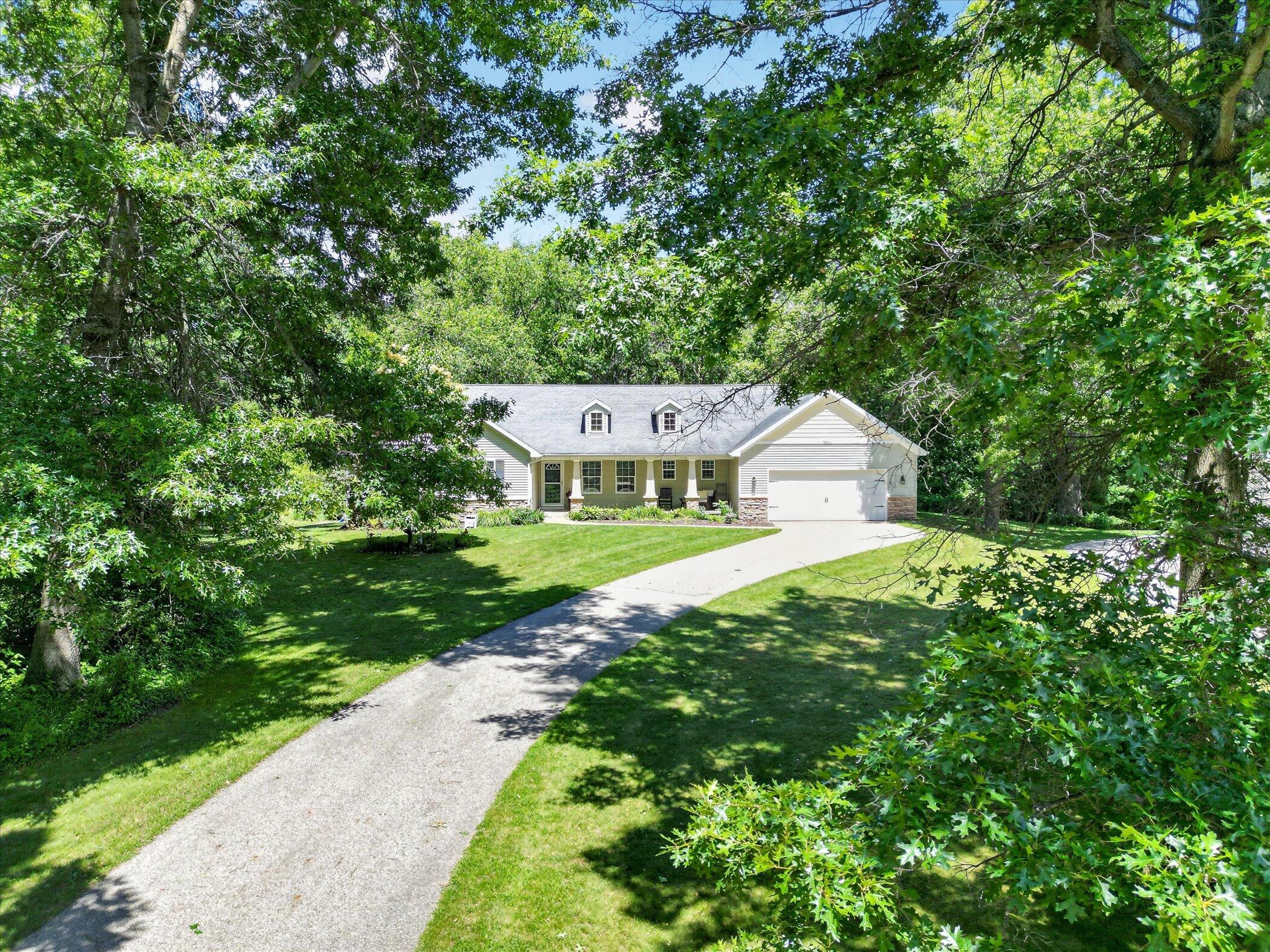 8669 Lilly Ridge Drive Alto, MI 49302 - Photo 49 of 53 51-8669-Lilly-Ridge-Dr-Alto-WindowStill