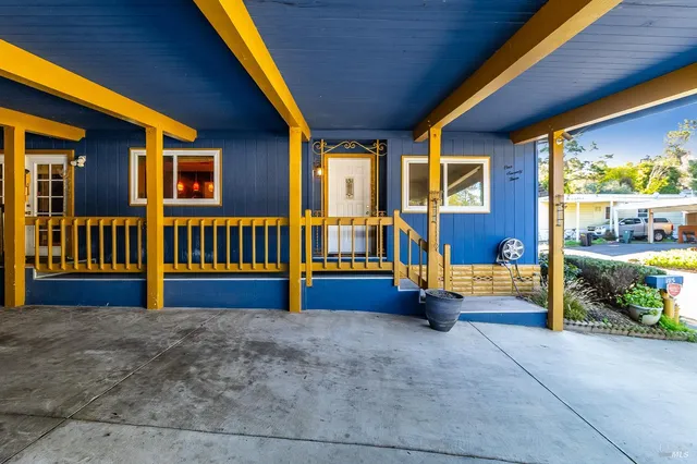 a view of a front door of house and wooden door